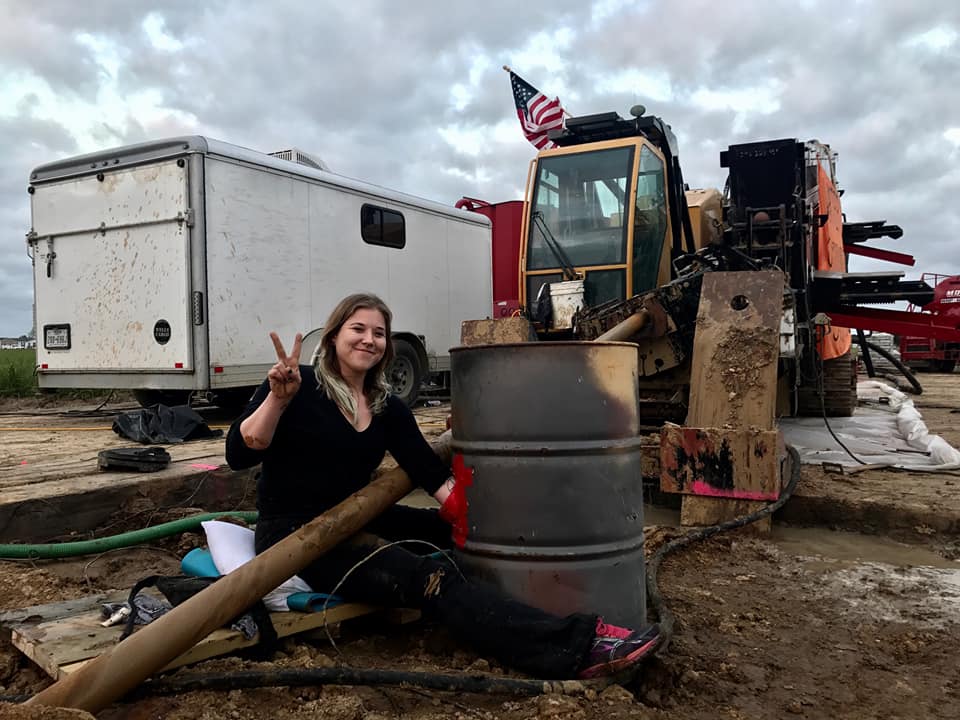 A protester locks herself to a barrel of concrete during a recent action protesting construction of the Bayou Bridge Pipeline.