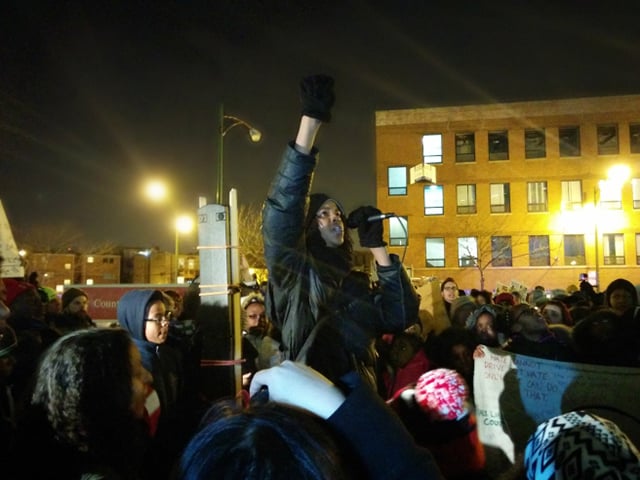 Kaleb Autman leads the crowd in a chant of solidarity with the incarcerated youth. (Photo: Kelly Hayes)