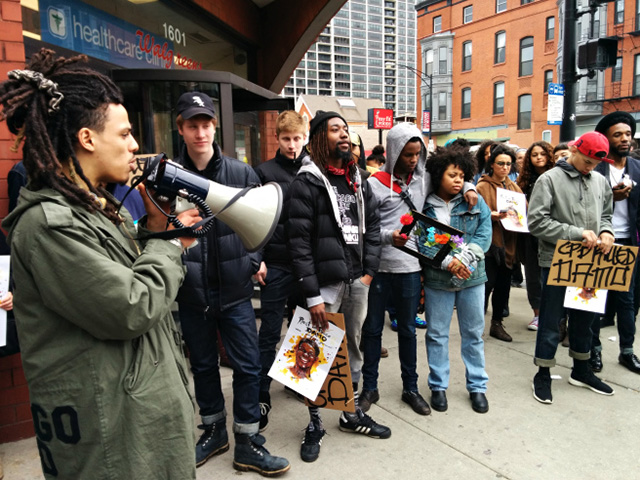 Damo’s friends and supporters of We Charge Genocide gather outside the Walgreens where Damo ran from police, just before being tased to death for stealing a bottle of liquor. (Photo: Kelly Hayes)