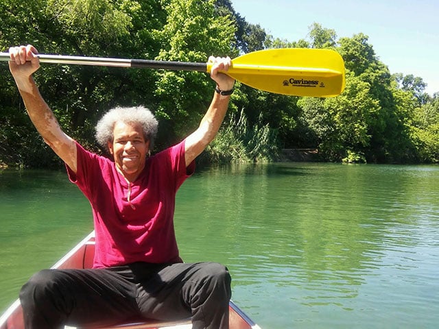 Albert enjoys a canoe ride in Austin, TX.