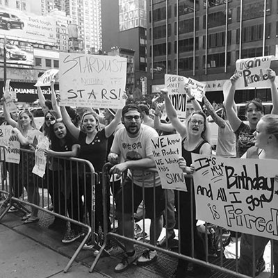 The members of Stardust Family United protest outside of Ellen’s Stardust Diner. (Photo: Meg Doherty)
