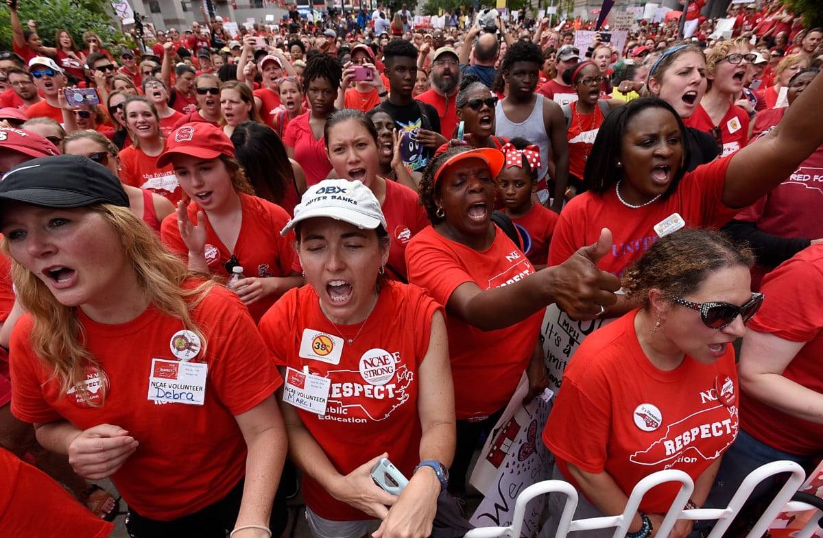Crowds cheer during the Rally for Respect outside the North Carolina Legislative Building on May 16, 2018 in Raleigh, North Carolina. Several North Carolina counties closed schools to allow teachers to march on the opening day of the General Assembly.