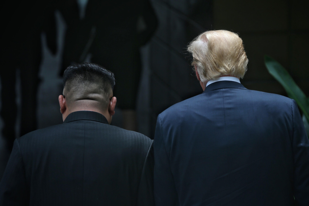 North Korean leader Kim Jong-un and President Donald Trump walk during their summit at the Capella Hotel on Sentosa island on June 12, 2018, in Singapore.