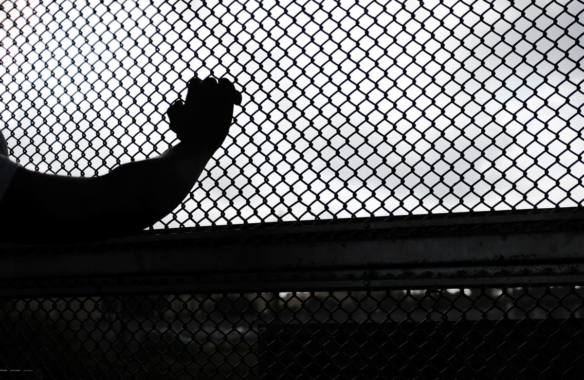 A Cuban man seeking asylum waits along the border bridge after being denied into the Texas city of Brownsville which has become dependent on the daily crossing into and out of Mexico on June 22, 2018, in Brownsville, Texas.