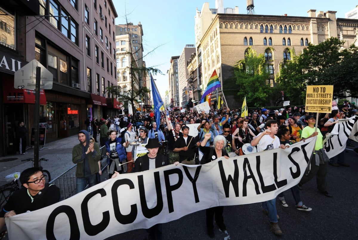 Occupy Wall Street protesters march down Broadway toward lower Manhattan in May, 2012. The Occupy movement represented "open spaces of resistance" and power emanating from group organizing.