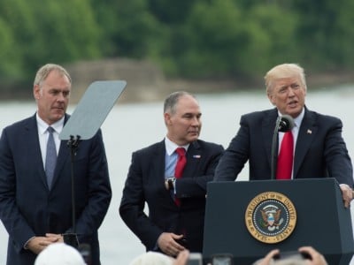 President Donald Trump, with US Secretary of the Interior Ryan Zinke (L) and EPA Administrator Scott Pruitt, speaks in Cincinnati, Ohio, on June 7, 2017.