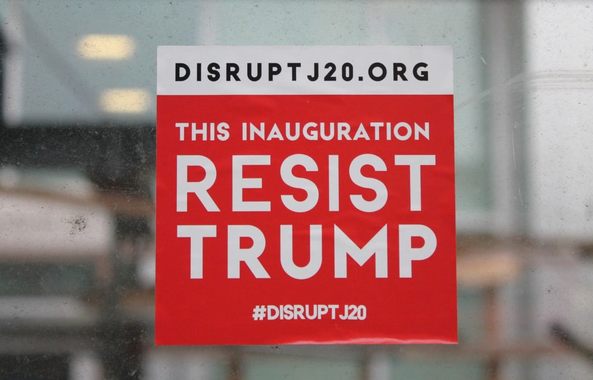 A #DisruptJ20 sticker