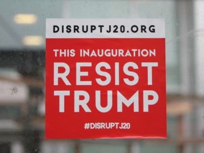 A #DisruptJ20 sticker