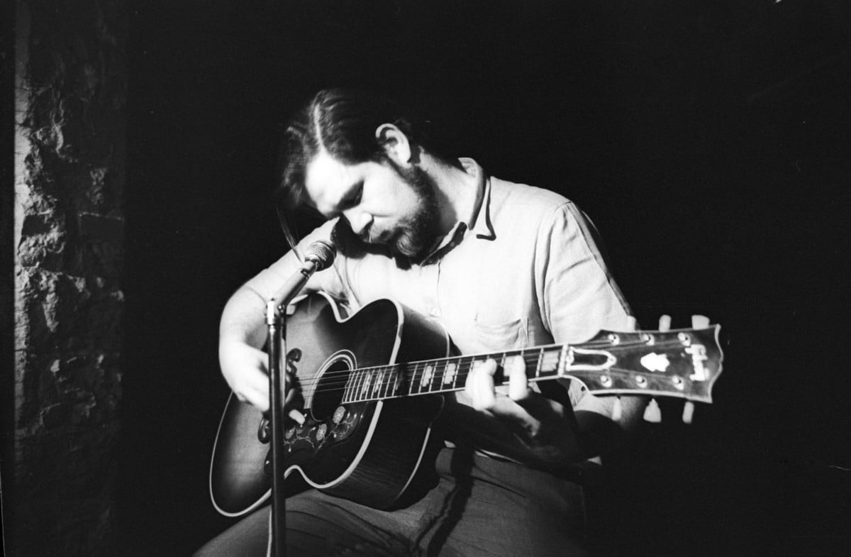 Folk singer Dave Van Ronk performs onstage at the Gaslight on June 22, 1964 in New York, New York.