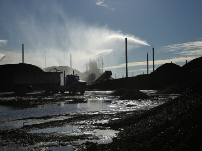 The KCBX petcoke storage facility in Chicago is pictured on Monday, January 13, 2014. The facility employed a network of 60-foot tall sprinklers to combat dust from the uncovered piles of petroleum coke, also known as petcoke.