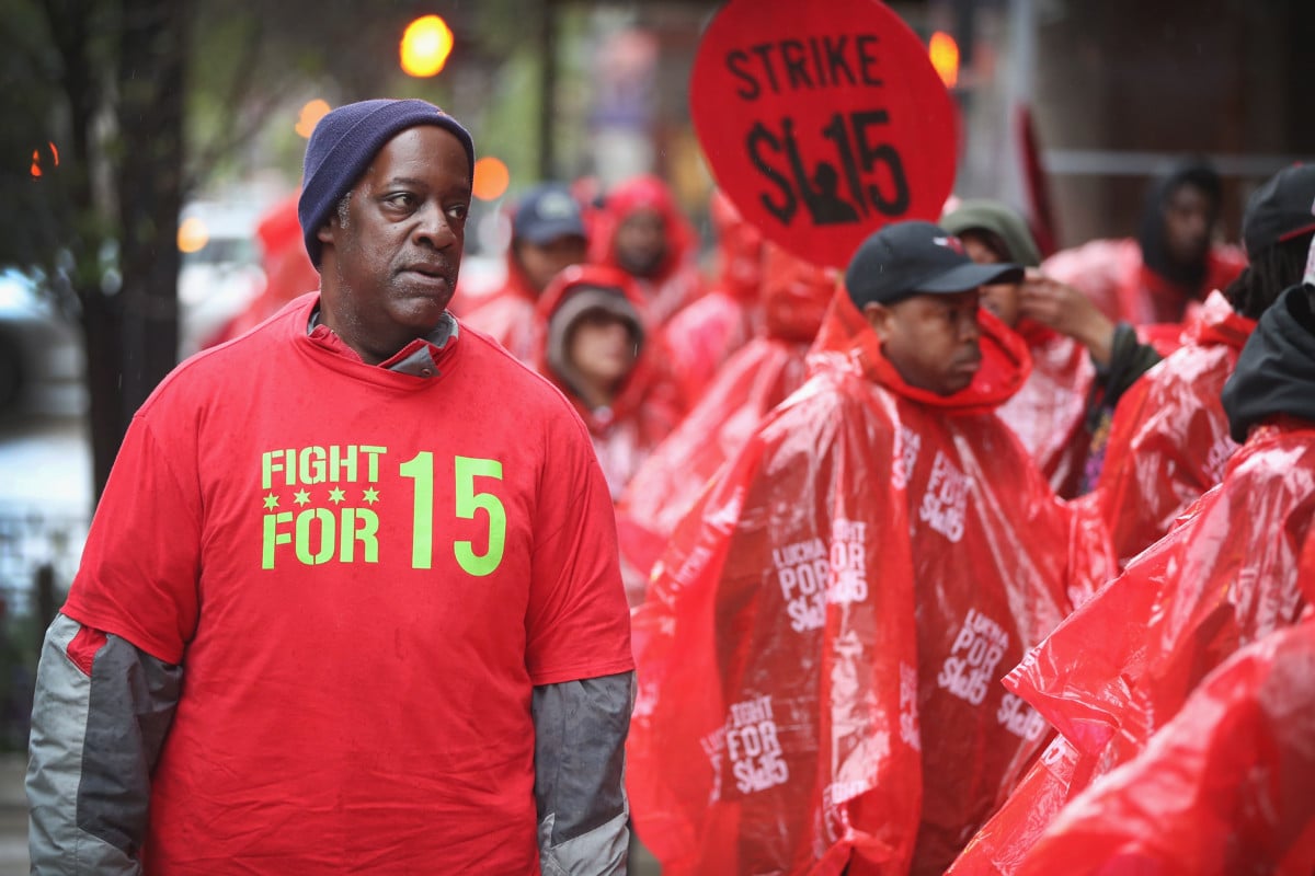 Fast-food workers and activists demonstrate outside McDonald's downtown flagship restaurant on May 15, 2014, in Chicago, Illinois.
