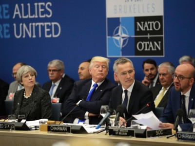 Britain's Prime Minister Theresa May, President Donald Trump and NATO Secretary General Jens Stoltenberg look on as Belgian Prime Minister Charles Michel speaks during a working dinner meeting at the NATO headquarters in Brussels on May 25, 2017.