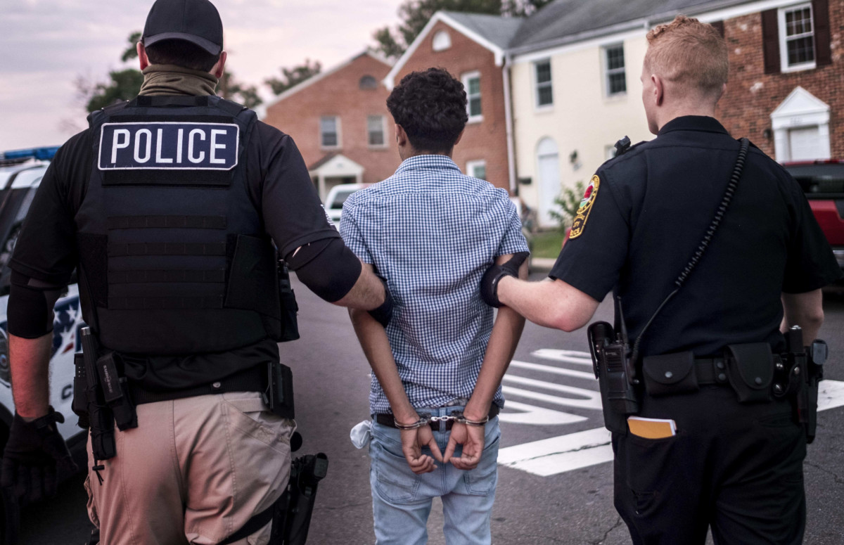 Northern Virginia Gang Task Force officers partner with ICE officer to arrest a Latino man in a Manassas, Virginia, neighborhood on August 10, 2017.