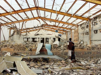 Yemenis inspect the damage caused by a Saudi-led air strike on a cholera treatment center supported by Doctors Without Borders (MSF) in the Abs region of Yemen on June 11, 2018.