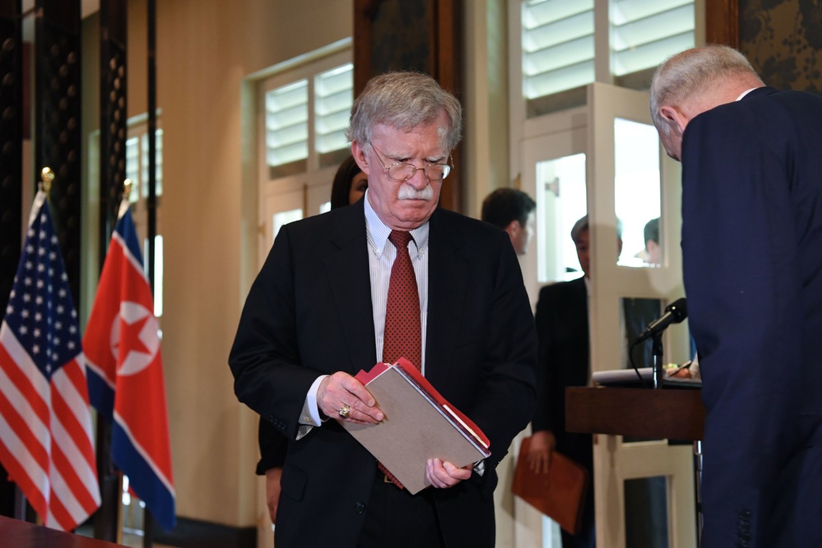National Security Adviser John Bolton arrives for a signing ceremony between North Korea's leader Kim Jong Un and President Trump during their US-North Korea summit, at the Capella Hotel on Sentosa Island in Singapore, on June 12, 2018.