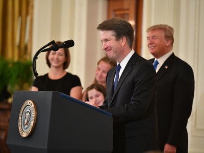 Supreme Court nominee Brett Kavanaugh speaks while his wife Ashley Estes Kavanaugh and President Donald Trump listen after the announcement of his nomination in the East Room of the White House on July 9, 2018, in Washington, DC.