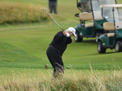 President Donald Trump hits a tee shot whilst playing a round of golf at Trump Turnberry Luxury Collection Resort during the President's first official visit to the United Kingdom on July 15, 2018, in Turnberry, Scotland.