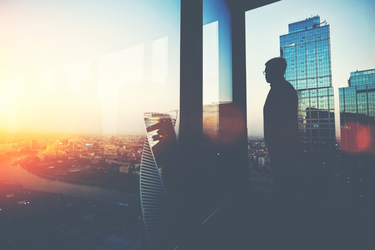 Silhouette of man in office tower