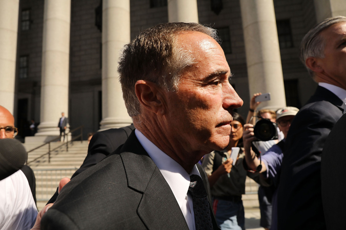 Rep. Chris Collins walks out of a New York court house after being charged with insider trading on August 8, 2018, in New York City.