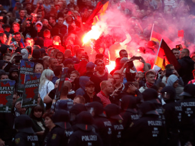 Right-wing demonstrators light flares on August 27, 2018, in Chemnitz, eastern Germany, following the death of a 35-year-old German national who died in a hospital after a "dispute between several people of different nationalities," according to the police.