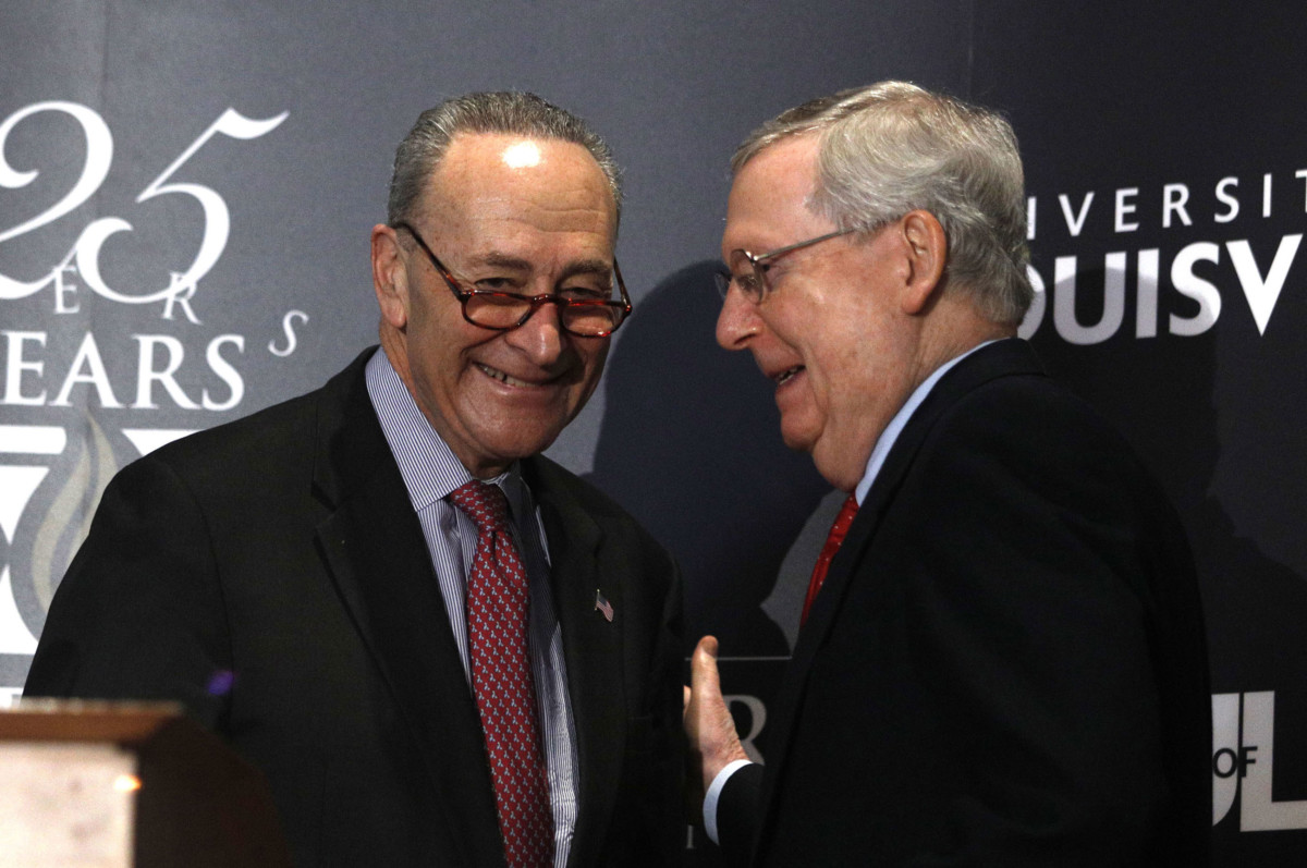 Senate Majority Leader Mitch McConnell and Senate Democratic Leader Chuck Schumer shake hands after Shumer delivered a speech at the University of Louisville's McConnell Center on February 12, 2018, in Louisville, Kentucky.