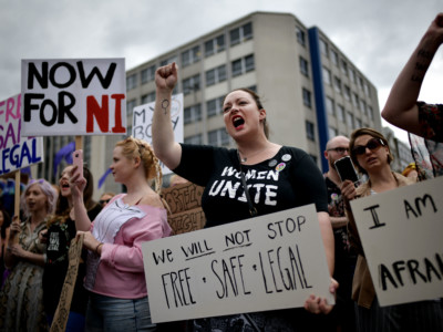 Pro-choice activists take part in the "Rally for Choice" demonstration at Belfast City Hall on July 7, 2018, in Belfast, Northern Ireland.