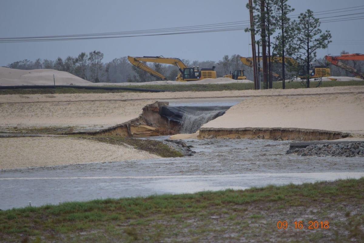 Rainwater from Hurricane Florence causes a "waterfall" of coal ash from a waste landfill at the site of a power plant operated by Duke Energy near Wilmington, North Carolina, on September 16, 2018.
