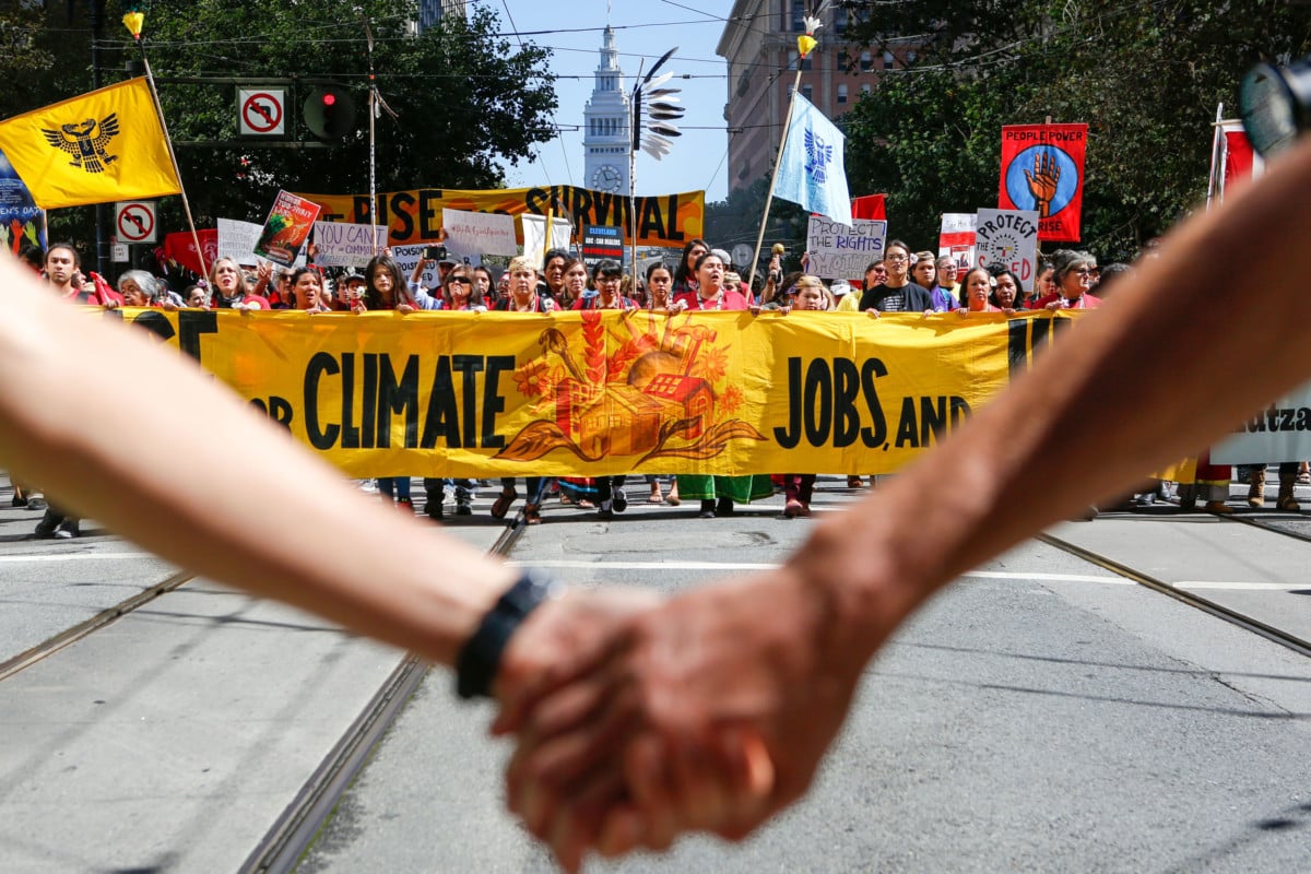 Crowds march up Market Street during the "Rise For Climate" global action on September 8, 2018, in downtown San Francisco, California.
