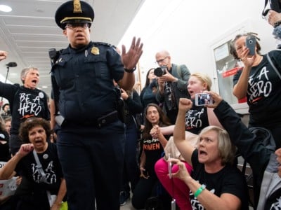 US Capitol Police prepare to arrest demonstrators as they protest against the nomination of Judge Brett Kavanaugh to be a Supreme Court Justice outside of the office of US Sen. Susan Collins (R-Maine) on Capitol Hill in Washington, DC, September 24, 2018.