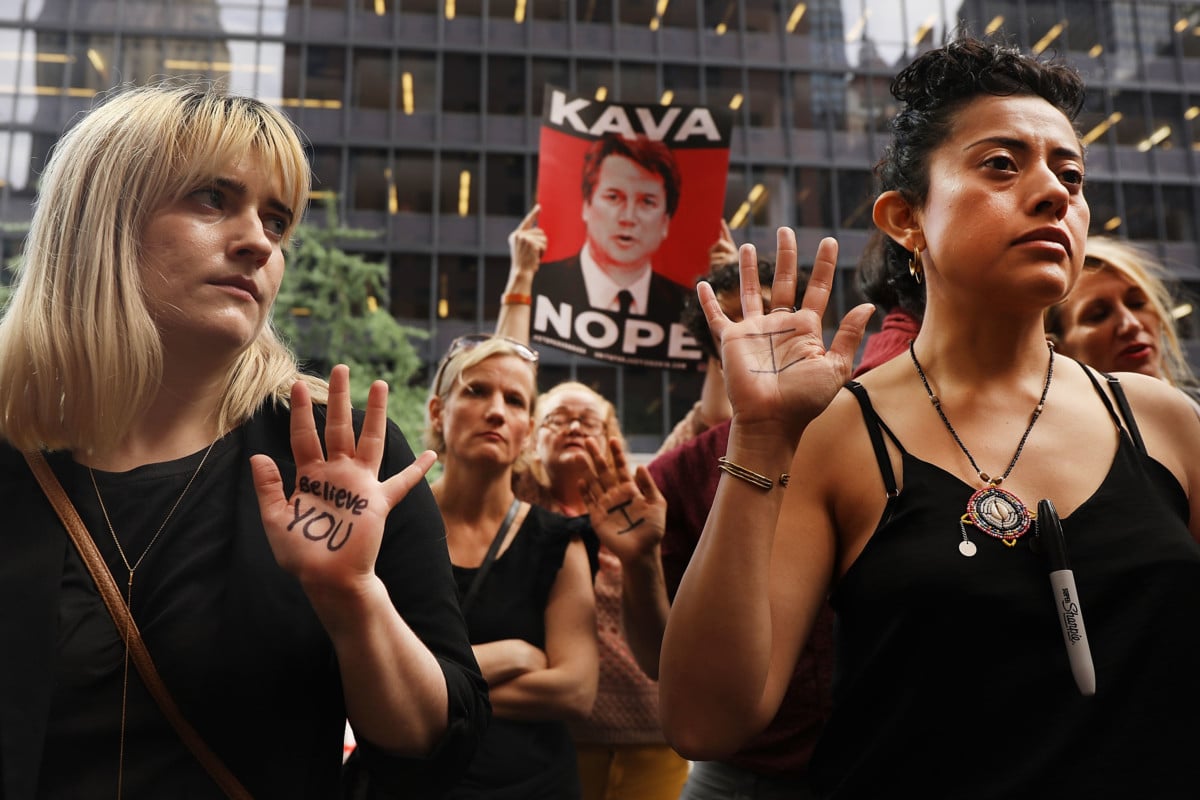Dozens of protesters against the confirmation of Republican Supreme court nominee Judge Brett Kavanaugh gather outside of Democratic Senator Chuck Schumer's office on the afternoon that the nation is watching Professor Christine Blasey Ford testify against Kavanaugh on September 27, 2018, in New York, New York. As people around the country watched, Ford gave emotional testimony about the alleged sexual assault before the Senate Judiciary Committee Thursday morning.
