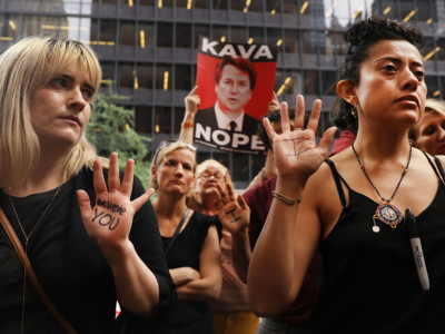 Dozens of protesters against the confirmation of Republican Supreme court nominee Judge Brett Kavanaugh gather outside of Democratic Senator Chuck Schumer's office on the afternoon that the nation is watching Professor Christine Blasey Ford testify against Kavanaugh on September 27, 2018, in New York, New York. As people around the country watched, Ford gave emotional testimony about the alleged sexual assault before the Senate Judiciary Committee Thursday morning.