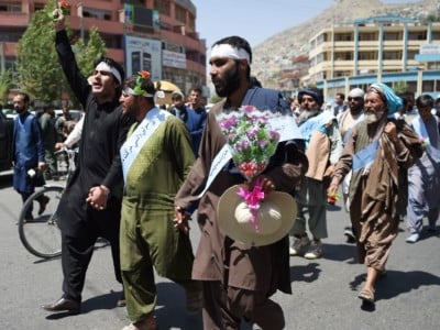 Afghan peace activists shout slogans in demand to an end to the war during a march from Helmand as they arrive in Kabul on June 18, 2018.