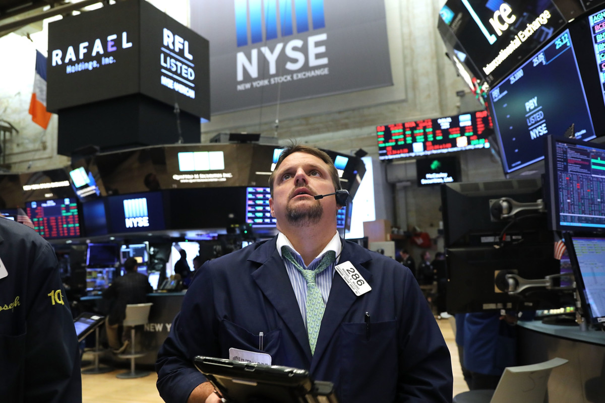 Traders work on the floor of the New York Stock Exchange on July 6, 2018, in New York City.