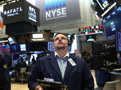 Traders work on the floor of the New York Stock Exchange on July 6, 2018, in New York City.