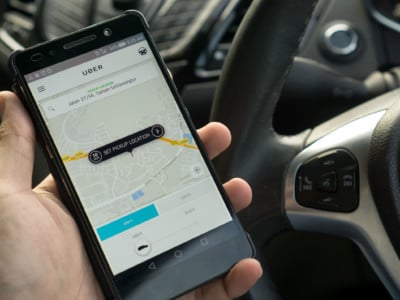 Driver with Uber app
