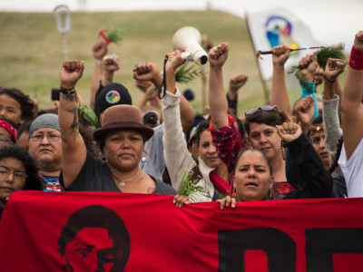 Native Americans march to a burial ground sacred site that was disturbed by bulldozers building the Dakota Access Pipeline, near the encampment where hundreds of people gathered to join the Standing Rock Sioux Tribe's protest, September 4, 2016, near Cannon Ball, North Dakota.