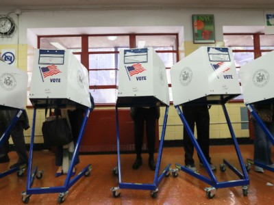 Voters cast their ballots at voting booths at PS198M The Straus School on November 8, 2016 in New York