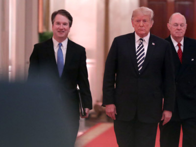 Supreme Court Justice Brett Kavanaugh, President Donald Trump and retired Justice Anthony Kennedy walk into the East Room of the White House for Kavanaugh's ceremonial swearing on October 8, 2018, in Washington, DC.