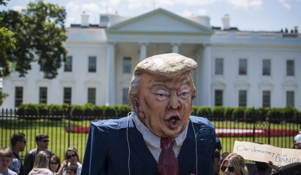 People protest in front of the White House in Washington, DC, on May 9, 2017. Trump's administration is aggressively pushing measures to restrict public protest and citizen participation.