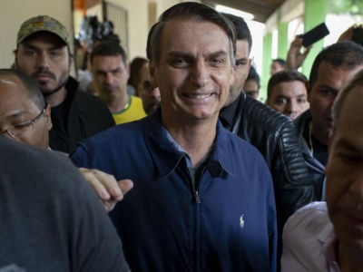 Brazil's right-wing presidential candidate Jair Bolsonaro leaves after casting his vote during the general elections in Rio de Janeiro, Brazil, on October 7, 2018.