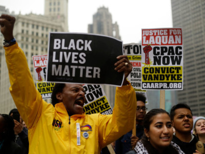Demonstrators protest as they celebrate the verdict in the murder trial of Chicago police officer Jason Van Dyke along Michigan Avenue on October 5, 2018, in Chicago, Illinois.