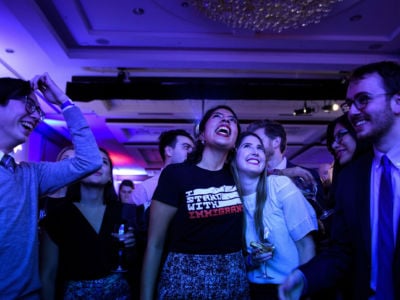 People cheer while watching election results during a midterm election night party hosted by the Democratic Congressional Campaign Committee, November 6, 2018, in Washington, DC.