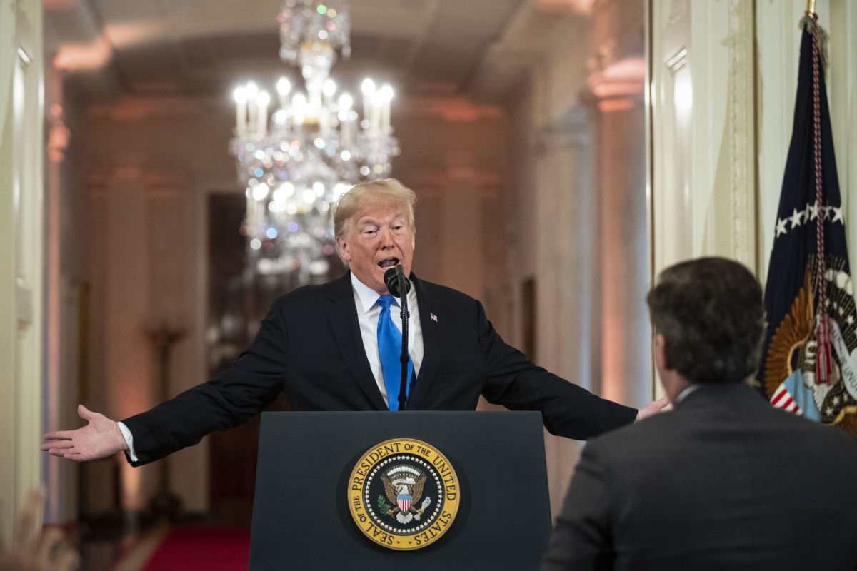 Donald Trump gets into an exchange with CNN reporter Jim Acosta during a news conference a day after the midterm elections on November 7, 2018, in the East Room of the White House in Washington, DC.