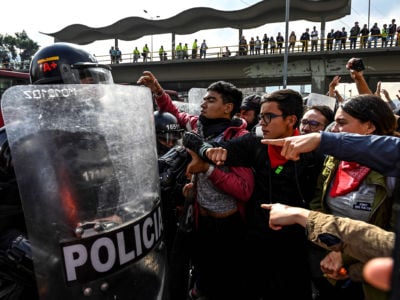 University students struggle with members of the national police during a protest for a budget increase for Colombian tertiary education and against a tax reform bill, in Bogota, Colombia, on November 21, 2018.