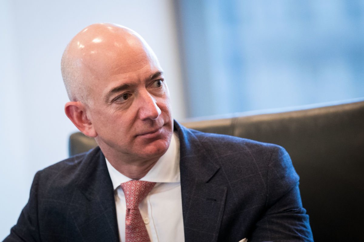Jeff Bezos, chief executive officer of Amazon, listens during a meeting between technology executives and Donald Trump at Trump Tower, on December 14, 2016, in New York City.