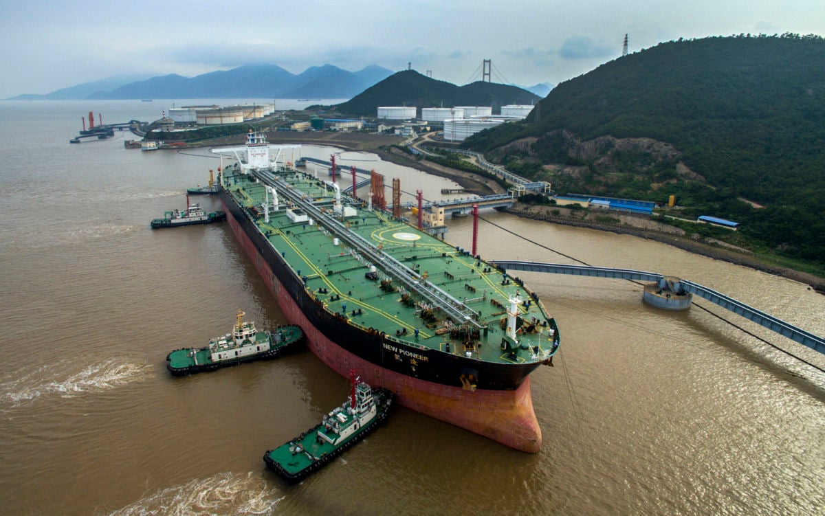 An oil tanker sits beside transfer pipes at a terminal as it prepares to unload its cargo of fuel on July 4, 2018, in Zhoushan, Zhejiang Province of China. Energy companies have sought more access to ports on the West Coast of the United States for decades for routes to Asia and Australia.