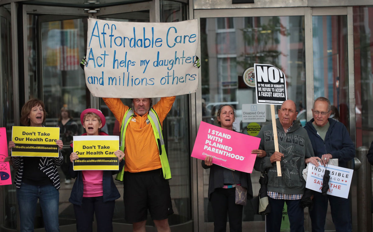 Demonstrators protest changes to the Affordable Care Act on June 28, 2017, in Chicago, Illinois.