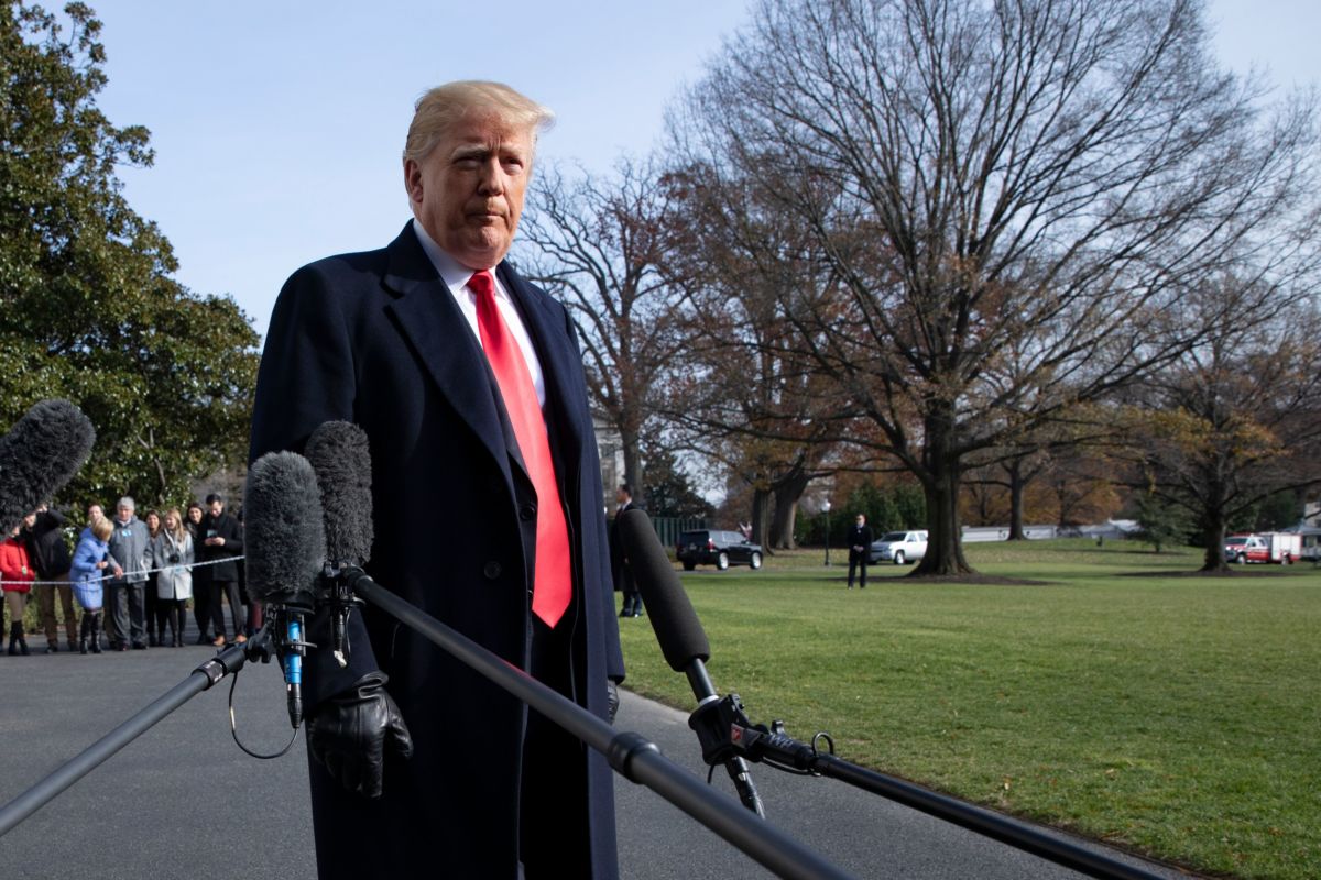 President Trump talks to reporters prior to boarding Marine One as he departs the White House in Washington, DC, on December 8, 2018.