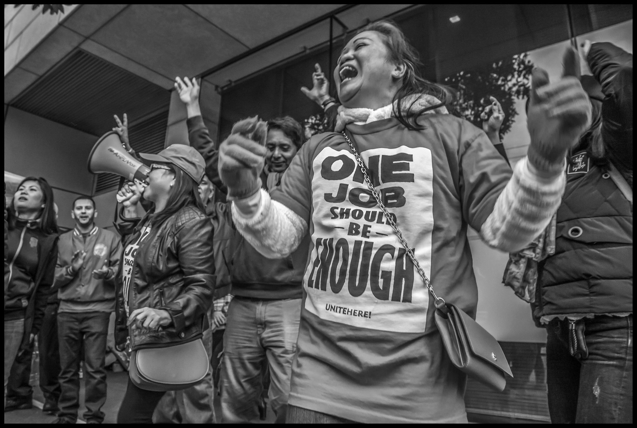 Strikers celebrate the end of the strike at the St. Regis Hotel.