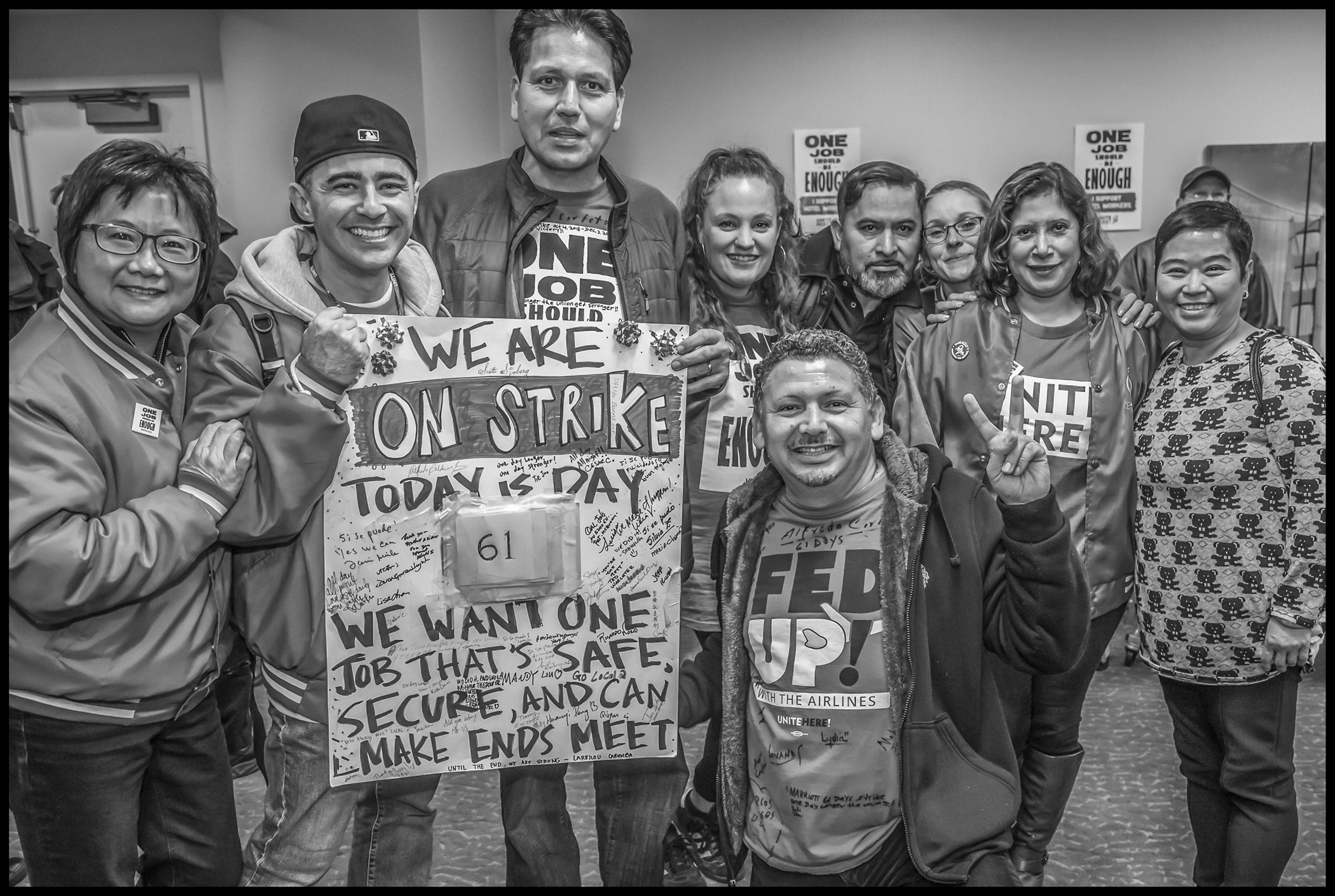 UNITE HERE Local 2 Treasurer Tina Chen and other Local 2 members and organizers with their picket signs celebrating the 61st and last day of the Marriott strike. Local 2 members stayed on strike longer than any of the other eight cities involved in the national Marriott strike.